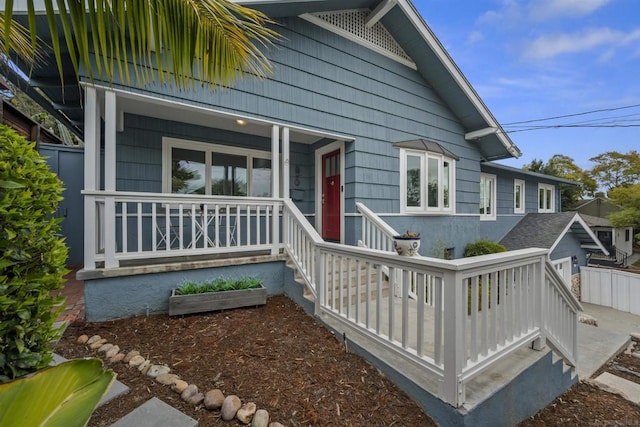 doorway to property featuring a porch