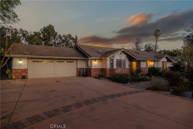 ranch-style house featuring a garage