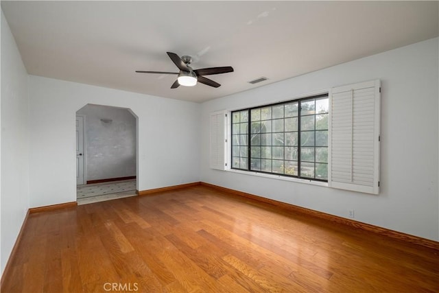 spare room featuring hardwood / wood-style flooring and ceiling fan