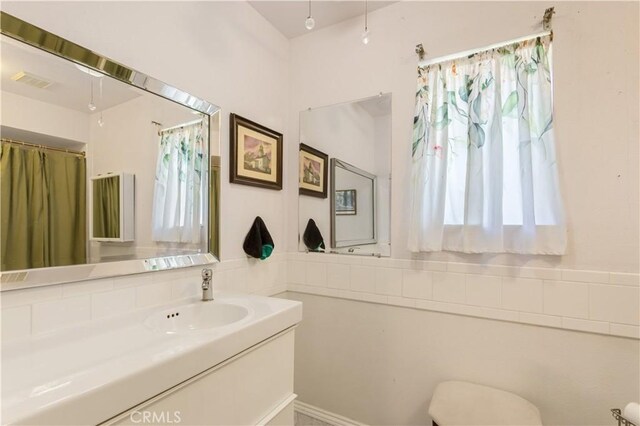 bathroom featuring visible vents and vanity