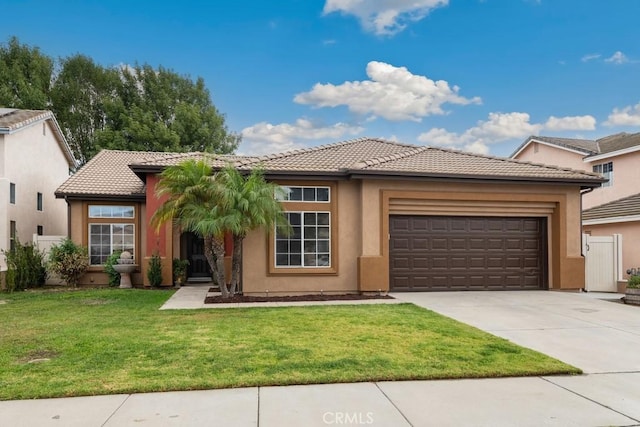 view of front of house with a garage and a front yard