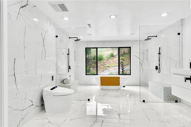 bathroom with vanity and independent shower and bath