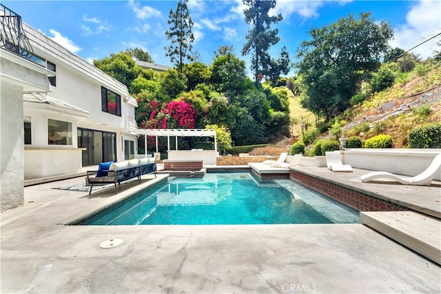 view of swimming pool with a patio, an outdoor hangout area, and a pergola