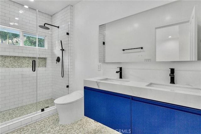 bathroom featuring vanity, walk in shower, and toilet