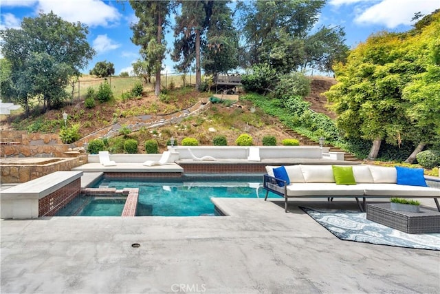 view of swimming pool featuring outdoor lounge area, a patio, and an in ground hot tub