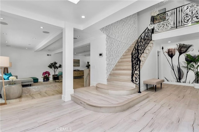 staircase with hardwood / wood-style floors