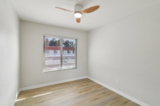 unfurnished room featuring ceiling fan and light wood-type flooring