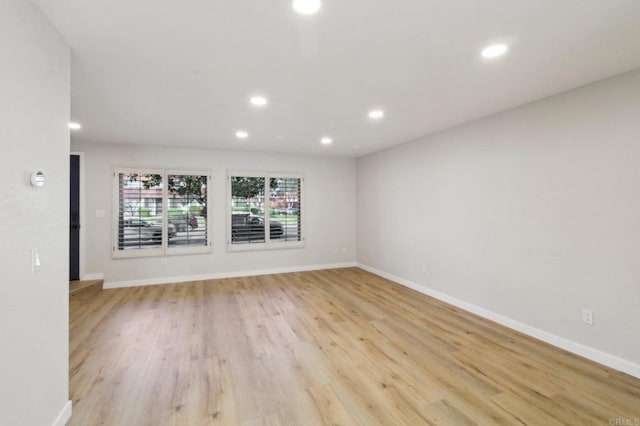 spare room featuring light hardwood / wood-style floors