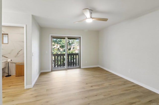 empty room featuring ceiling fan and light wood-type flooring