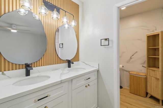 bathroom with vanity and hardwood / wood-style floors