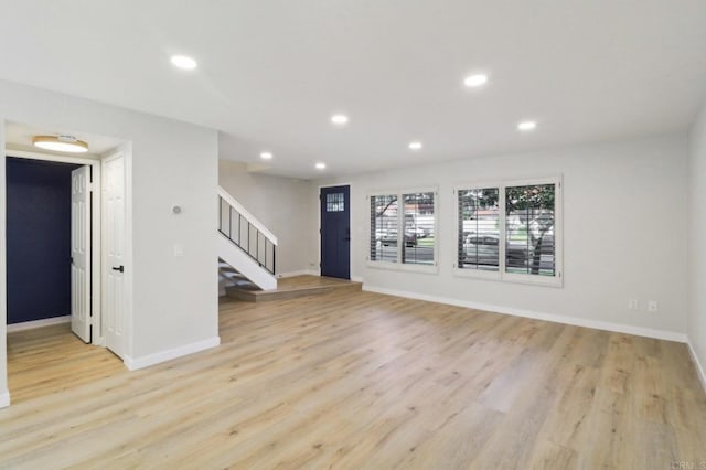 spare room with light hardwood / wood-style flooring