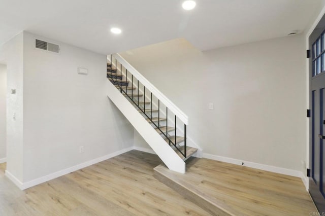 foyer entrance with hardwood / wood-style floors