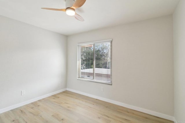 unfurnished room featuring ceiling fan and light wood-type flooring