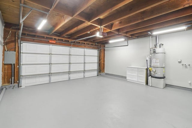 garage featuring water heater and a garage door opener