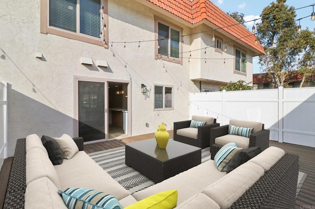 view of patio / terrace with an outdoor living space and fence