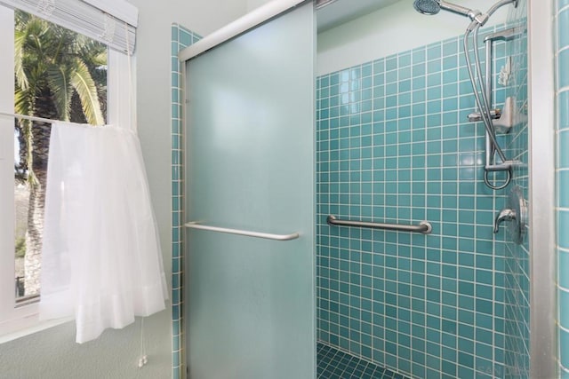 bathroom featuring an enclosed shower