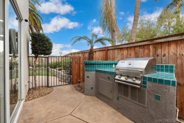 view of patio with exterior kitchen