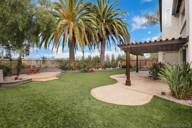 view of yard featuring a pergola and a patio area