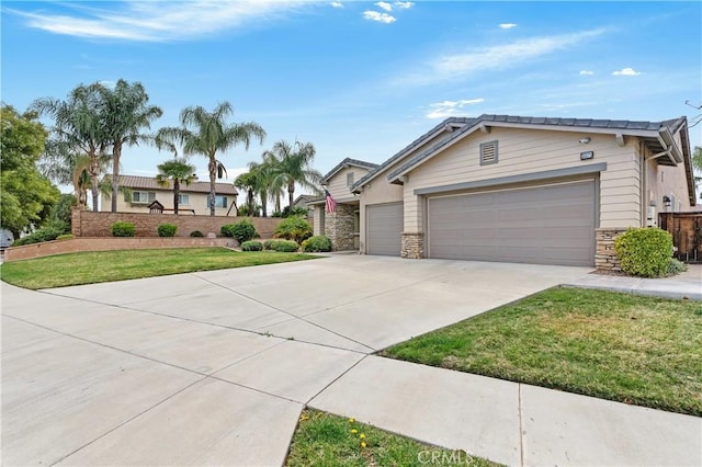 ranch-style house with a garage and a front yard