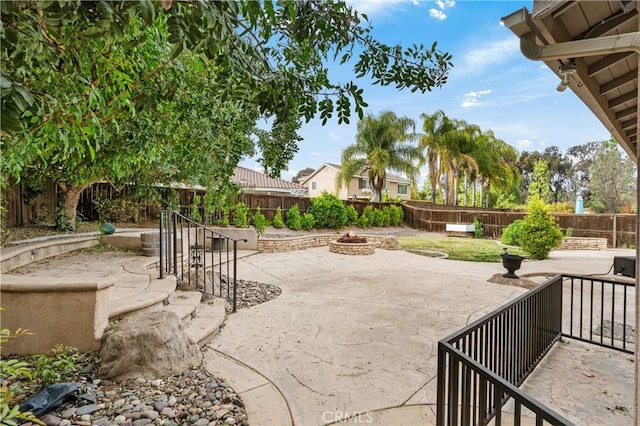 view of patio with a fire pit