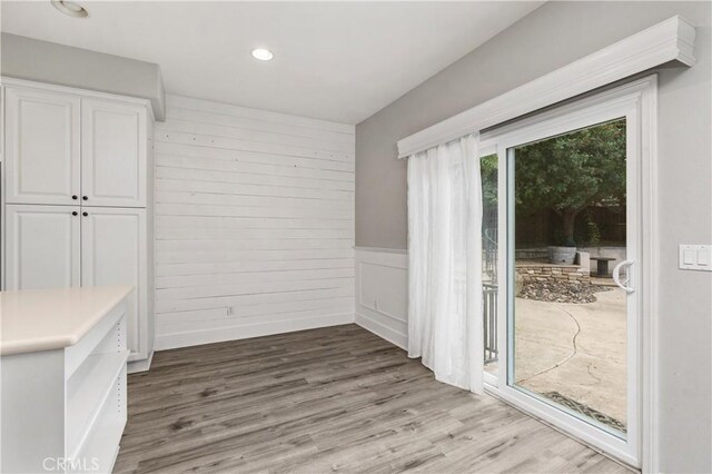 unfurnished dining area with wood-type flooring