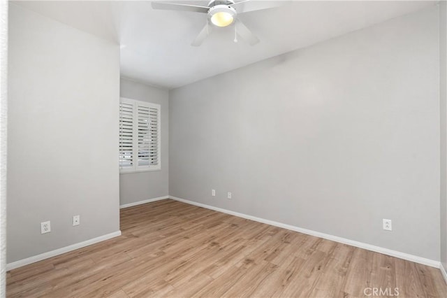 unfurnished room featuring ceiling fan and light wood-type flooring