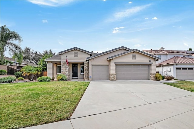 view of front of house with a garage and a front yard