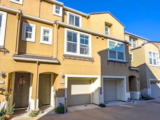 multi unit property featuring a garage