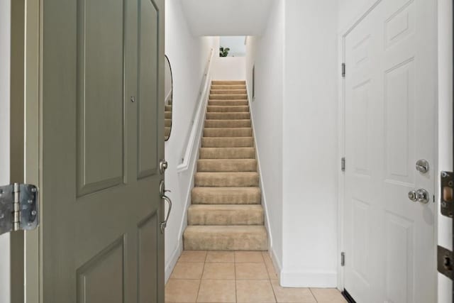 entryway with light tile patterned flooring