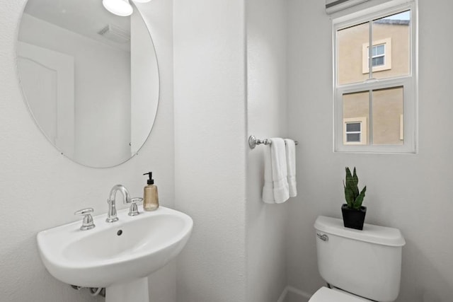 bathroom featuring sink and toilet