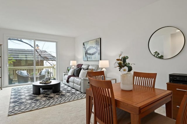 dining space featuring carpet flooring