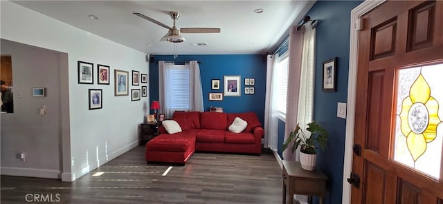 interior space with dark hardwood / wood-style floors and ceiling fan