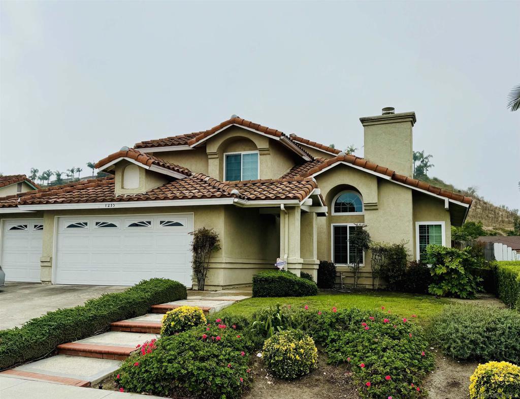 mediterranean / spanish-style house featuring a garage