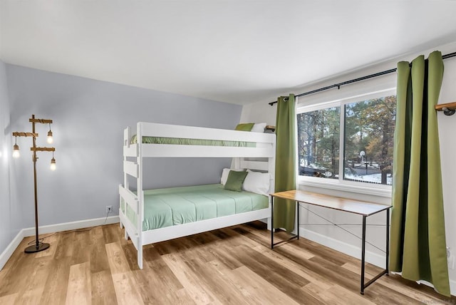 unfurnished bedroom featuring hardwood / wood-style flooring