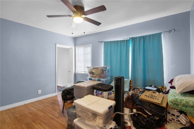 bedroom featuring hardwood / wood-style flooring and ceiling fan