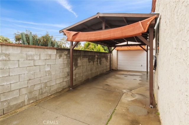 view of car parking featuring a garage