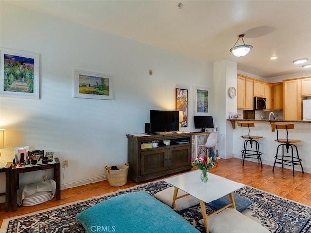 living room with light hardwood / wood-style floors