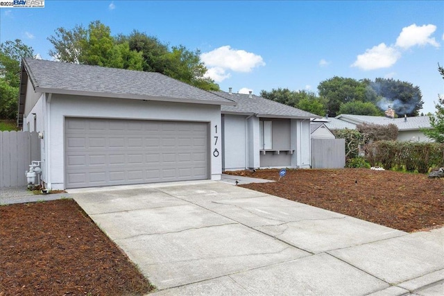 ranch-style home with a garage