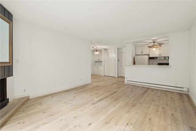 8740 Tuscany Ave Unit 109, Playa Del Rey, CA 90293 - unfurnished living room with a baseboard radiator, light wood-style flooring, ceiling fan, and a fireplace with raised hearth