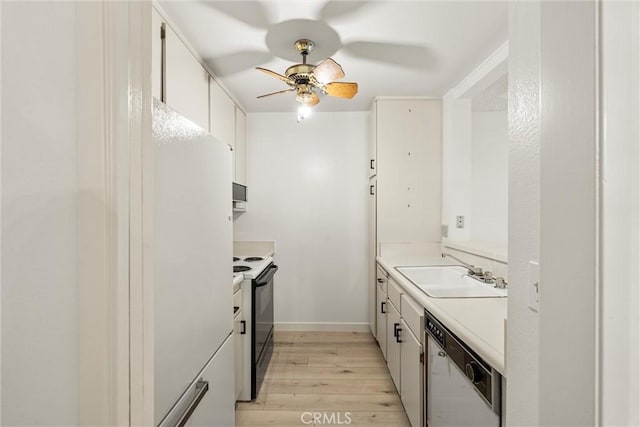 kitchen featuring white cabinetry, sink, ceiling fan, white appliances, and light hardwood / wood-style flooring