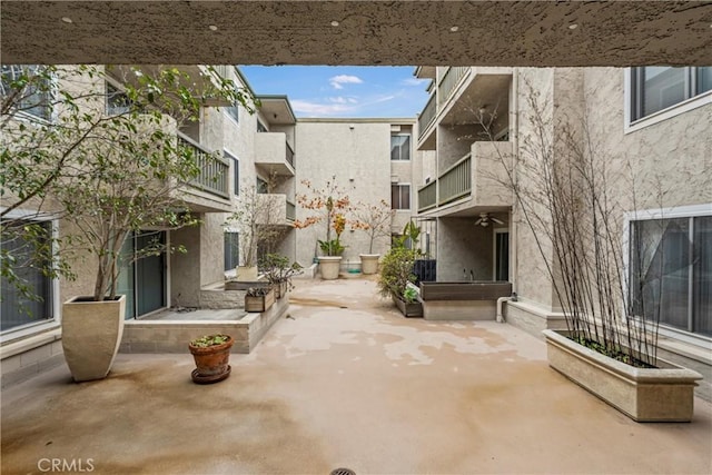 surrounding community featuring a patio area