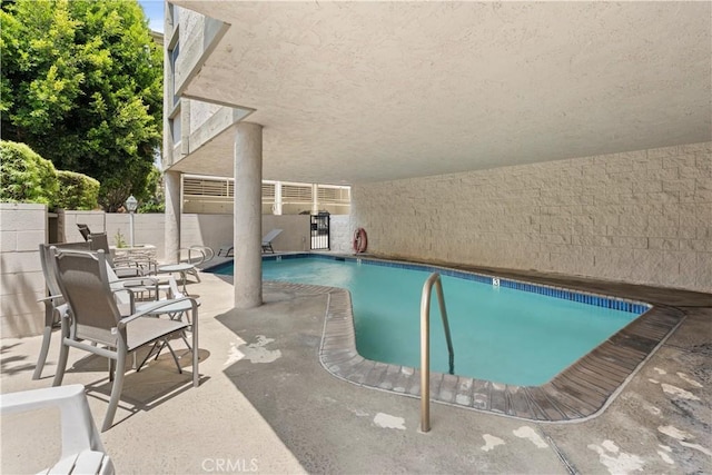 8740 Tuscany Ave Unit 109, Playa Del Rey, CA 90293 - view of swimming pool with a patio area and fence