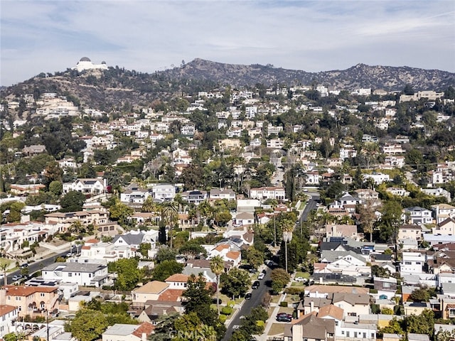 birds eye view of property featuring a mountain view