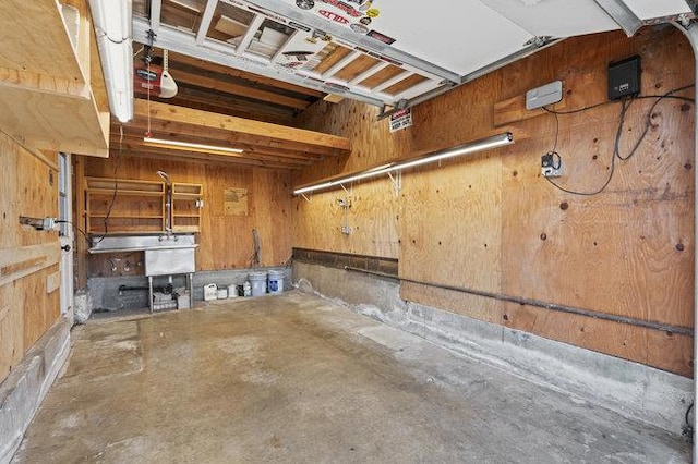 basement featuring wood walls