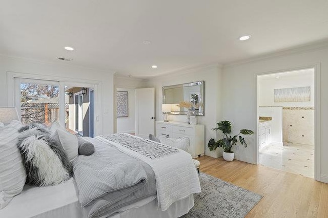 bedroom with crown molding, ensuite bathroom, access to outside, and light wood-type flooring