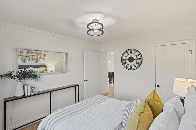 bedroom with ornamental molding