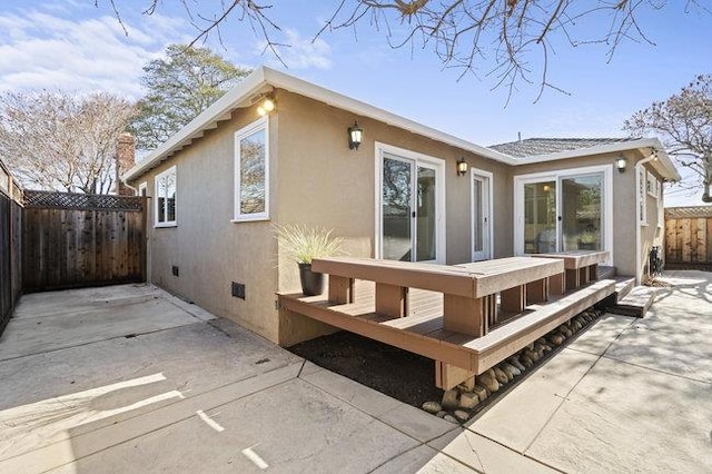 back of property with a patio area