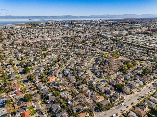 birds eye view of property featuring a water and mountain view