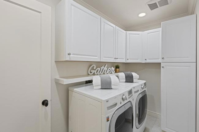 laundry area with cabinets and separate washer and dryer