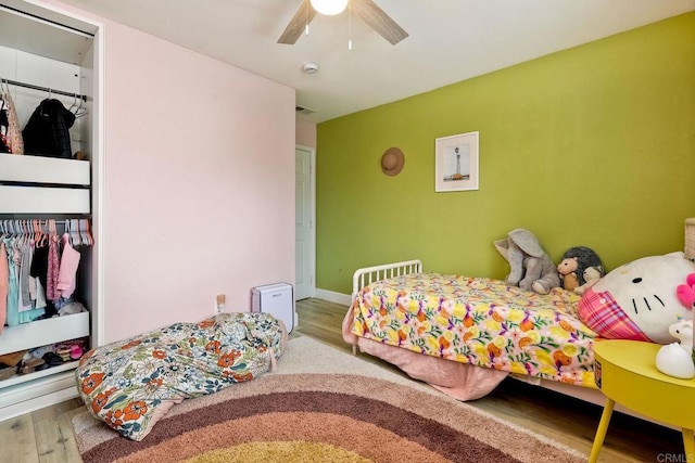 bedroom with hardwood / wood-style flooring and ceiling fan